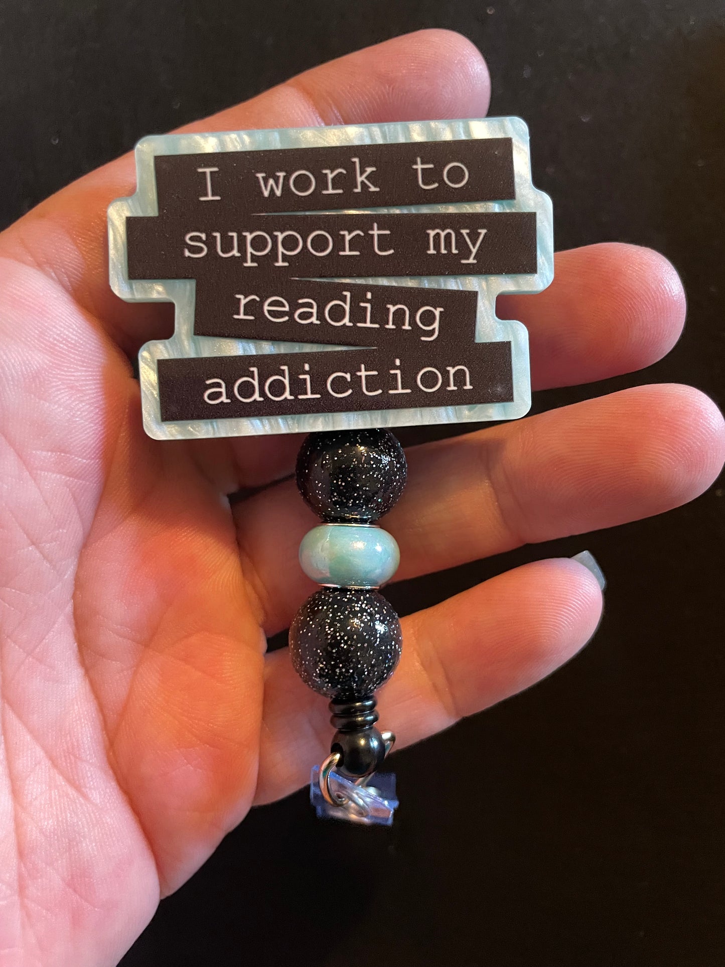 Light blue reading addiction badge reel