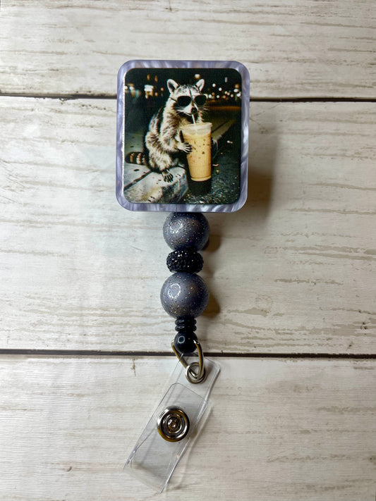 Coon with coffee badge reel