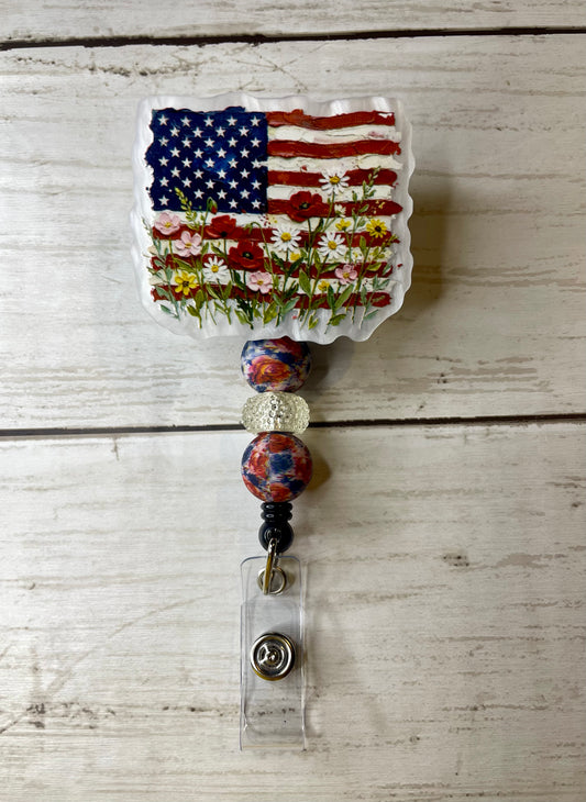 Floral flag badge reel