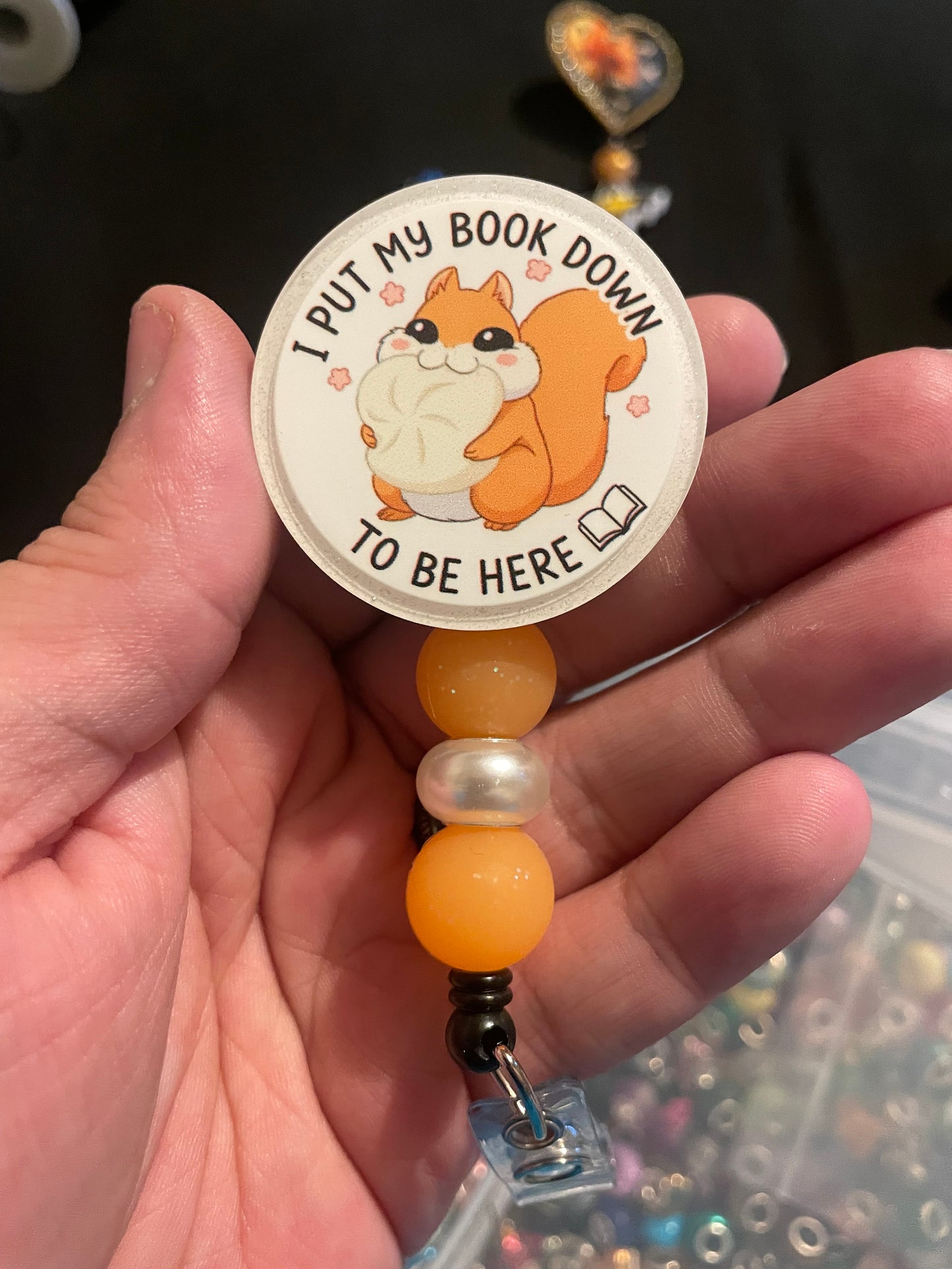 Cheeky put my book down badge reel