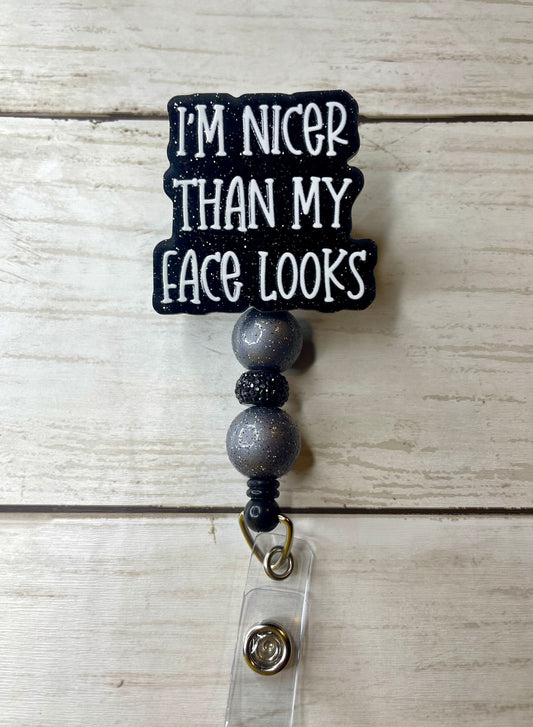 Nicer than my face looks badge reel